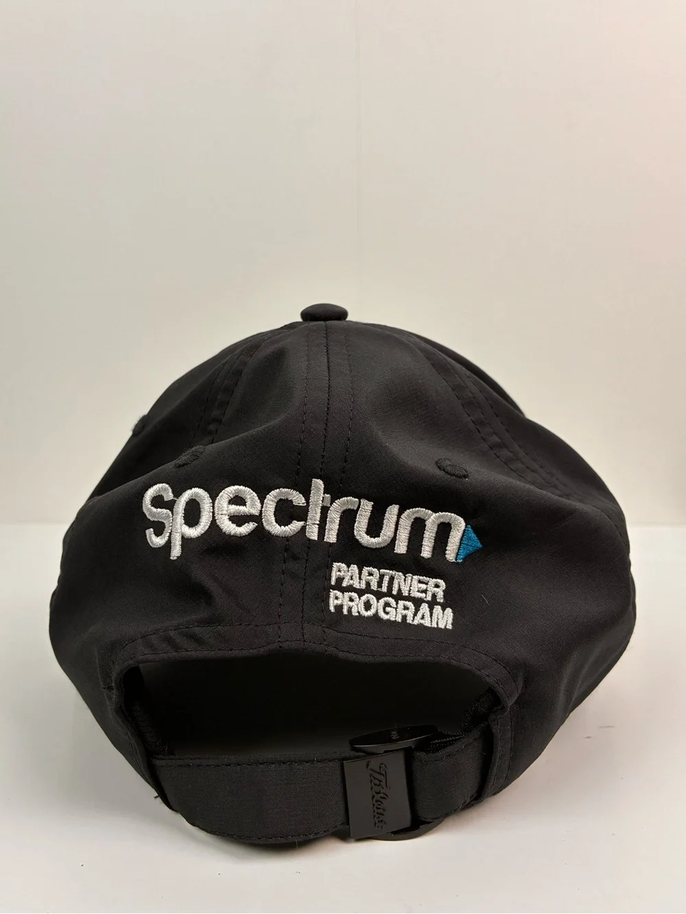 Titleist Tour Performance hat featuring embroidered Spectrum on the back OS